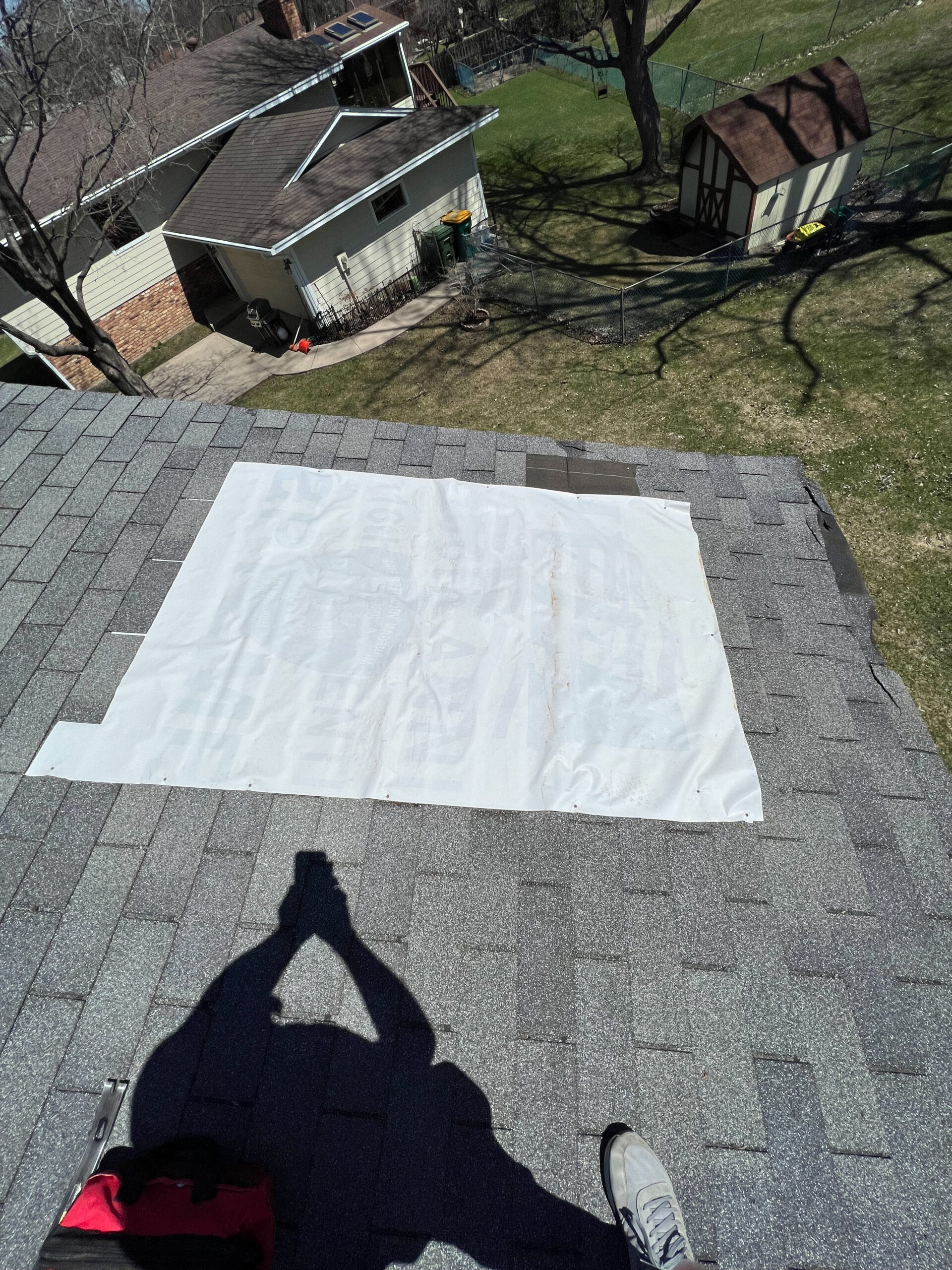 Roof with tarp covering area - emergency roof tarping minneapolis twin cities, minnesota