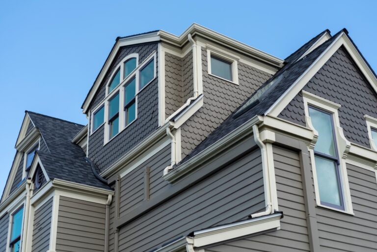 Roofing Forest Lake Large historic home under blue sky