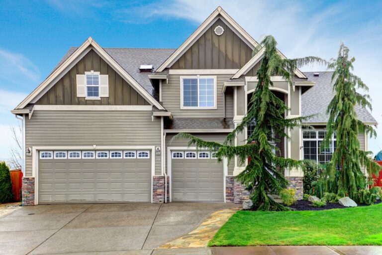 Roofing Forest Lake Beautiful olive siding house with tile roof, columns stoned at base, garage and green front trim