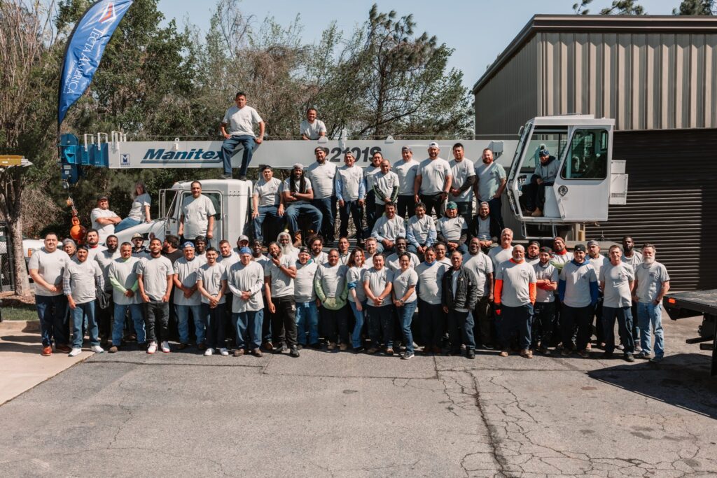 Group of workers in matching shirts. Best top commercial roofing companies in united states of america, Tecta America is one of them