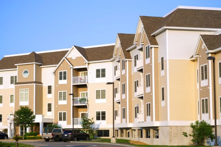 an apartment complex that owl roofing which is a premier multi-family roofing contractor could replace a roof and siding and gutters for