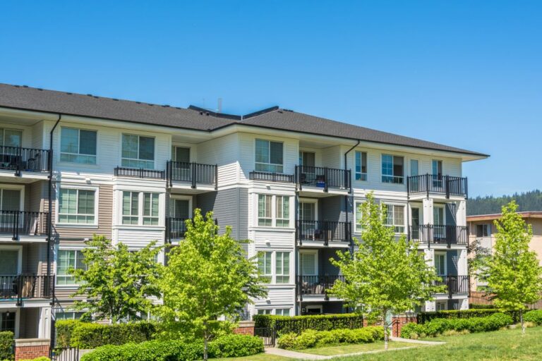 apartment complex with dark asphalt shingle roof