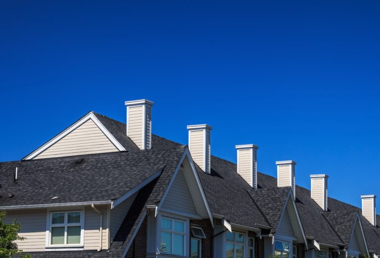 apartment with black asphalt roofing