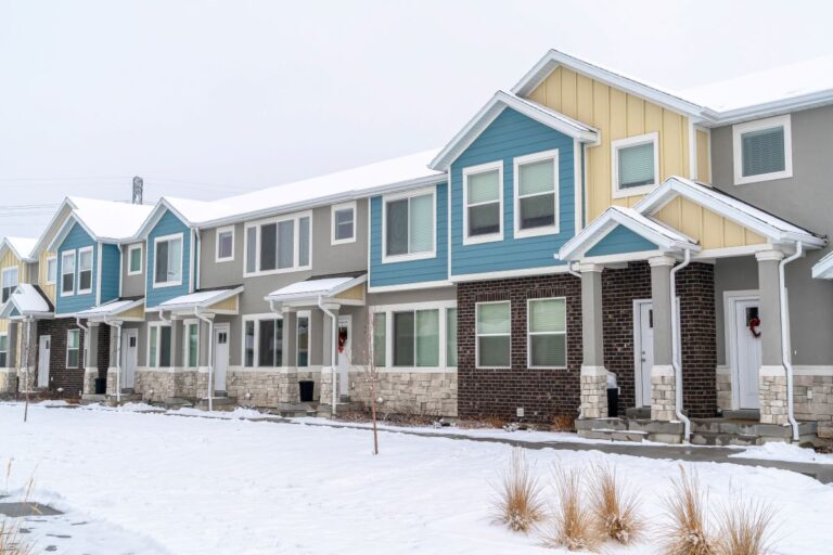 colorful apartments covered in snow