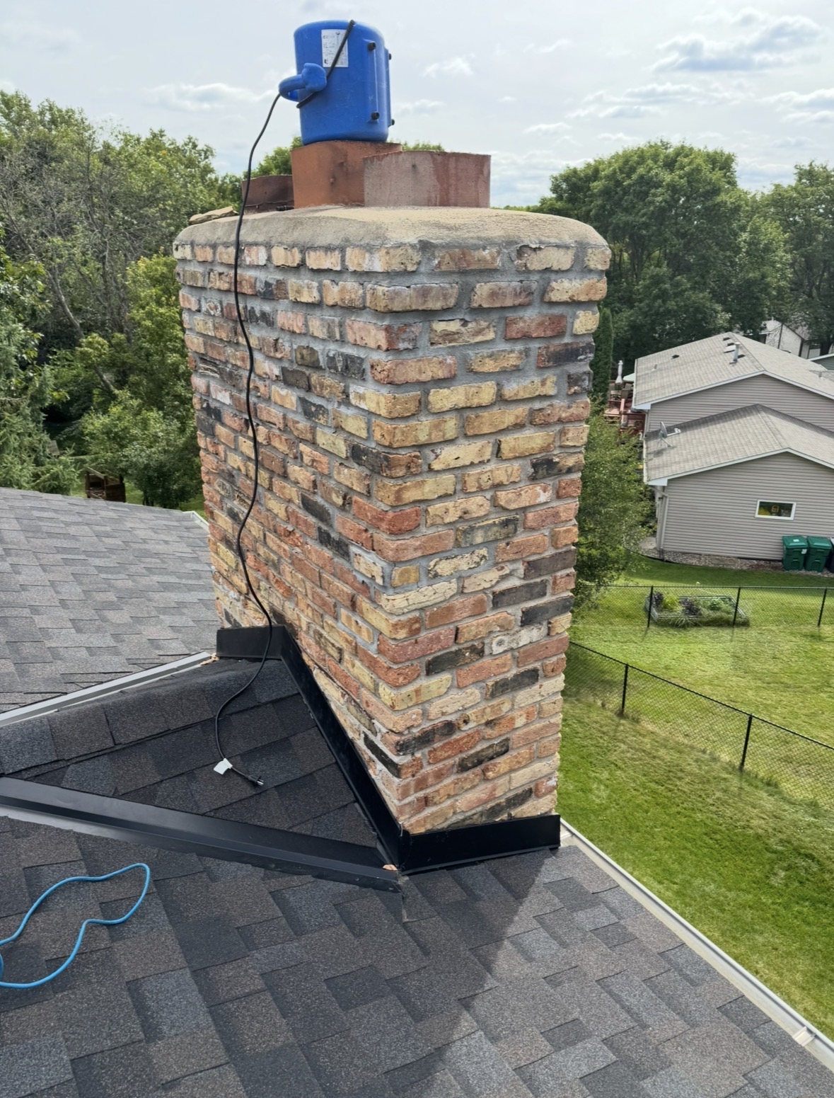 a roof cricket on a home in Shoreview Minnesota