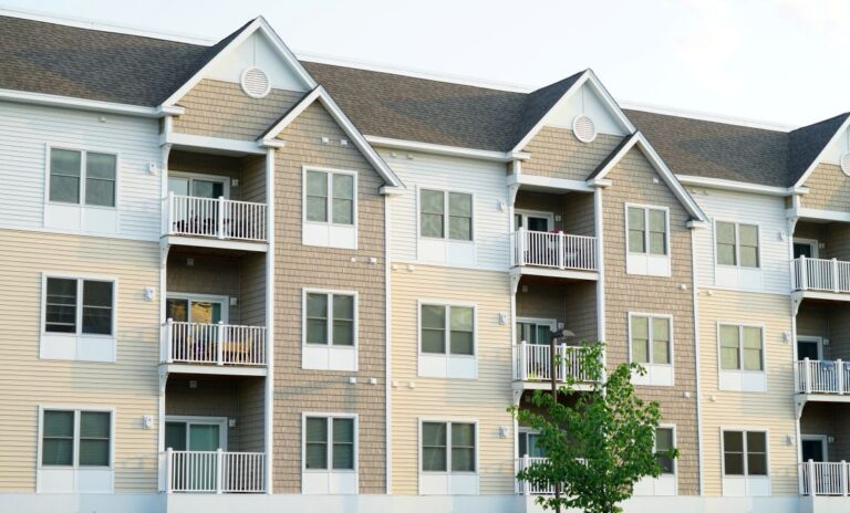 new apartment buildings with shingle roofs