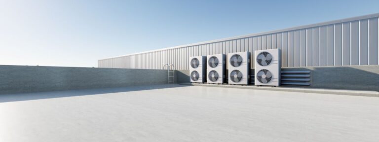 white flat commercial roof and vents