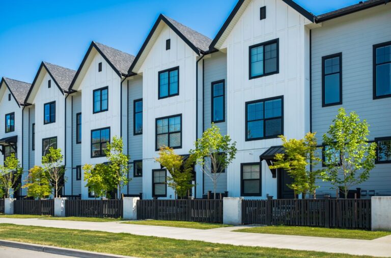 a photo of some apartment buildings that owl roofing replaced the roofs on