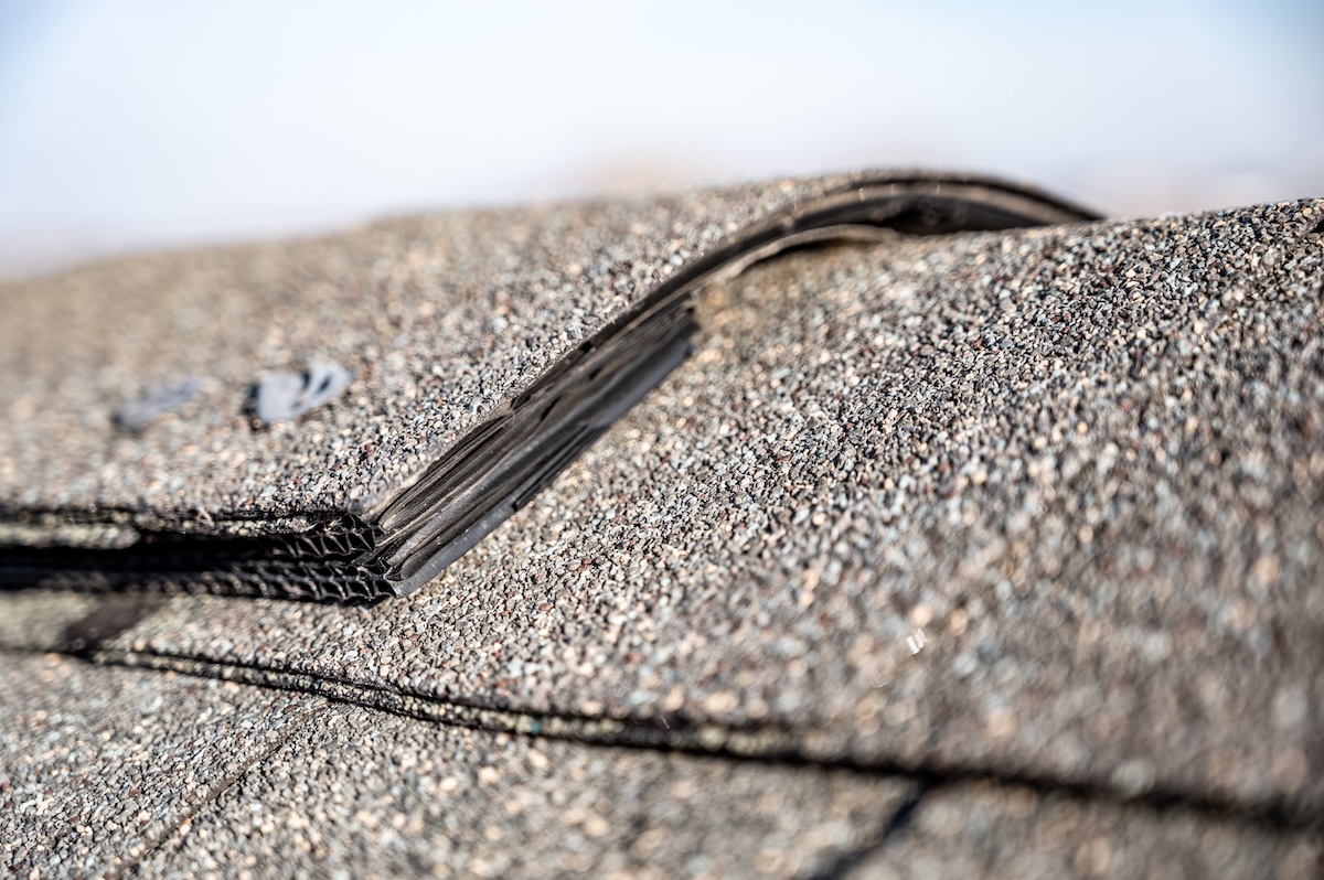 Typical residential ridge cap on a shingle roof apex