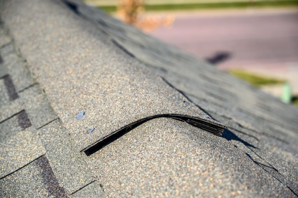 Close-up of an asphalt shingle roof with ridge cap