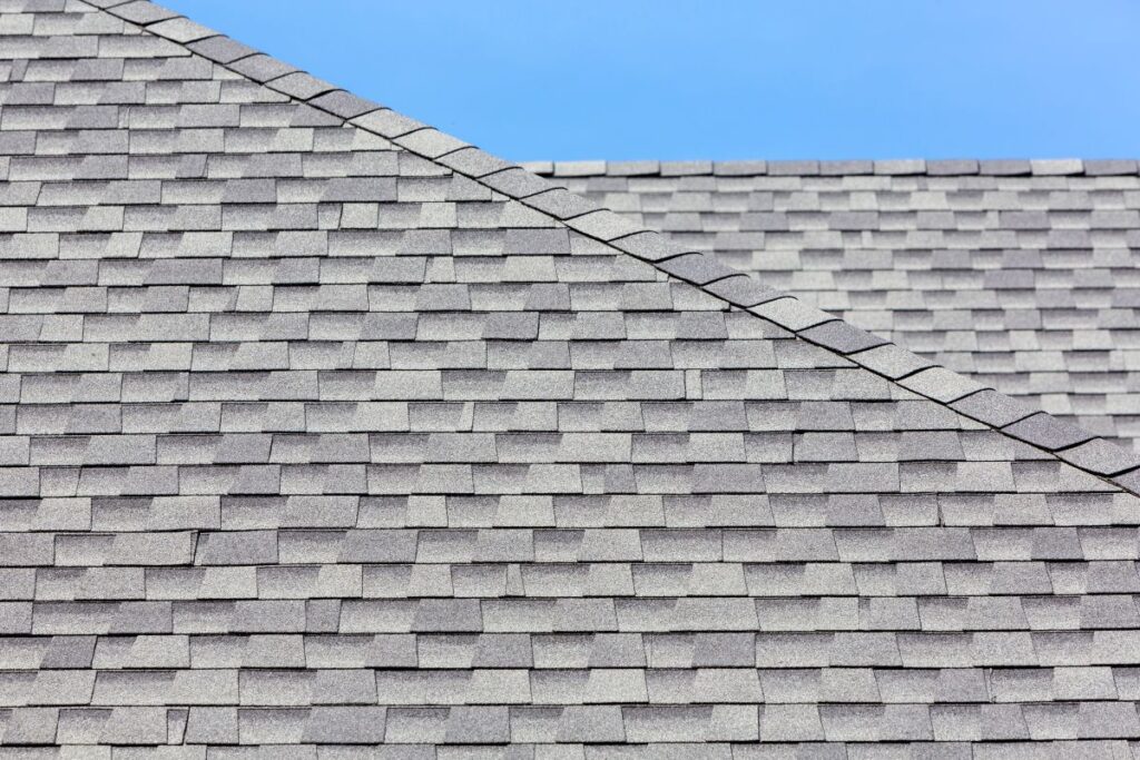 grey asphalt shingle roof with ridge cap shingles
