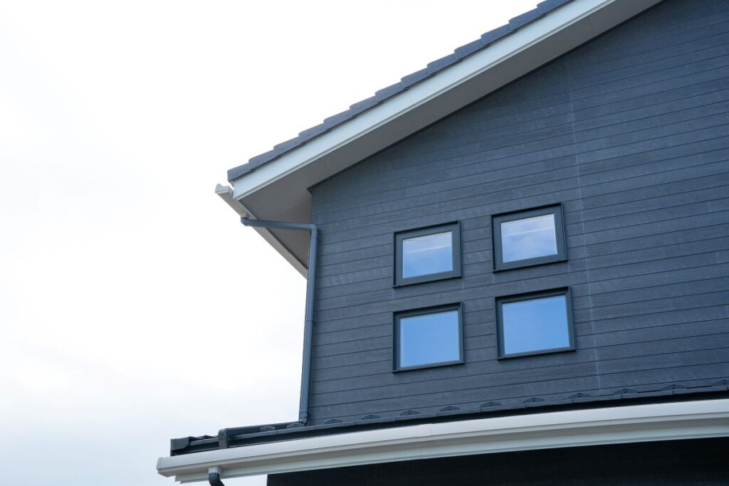 grey house with a roof eave